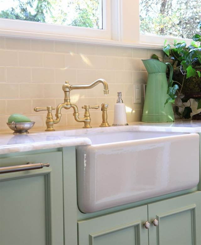 Brass Fixture and Farmhouse Apron Sink
