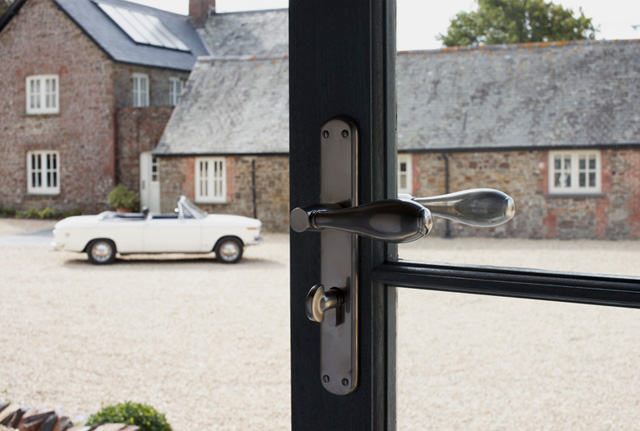 Combination Composite Door Lever in Ebony and Dark Bronze with Rounded Plate